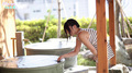 Outdoor tub filling with water bending to test the temperature