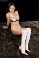 Kazuki yuu seated big breasts wearing bra knees raised white stockings high heels